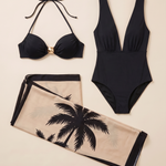 The three separate pieces: black halter bikini top, full two-shoulder one-piece swimsuit and beige palm-print sarong.