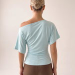 Asymmetric Neck Crop Top with Short Sleeves — full-length studio back view on a warm ivory seamless background