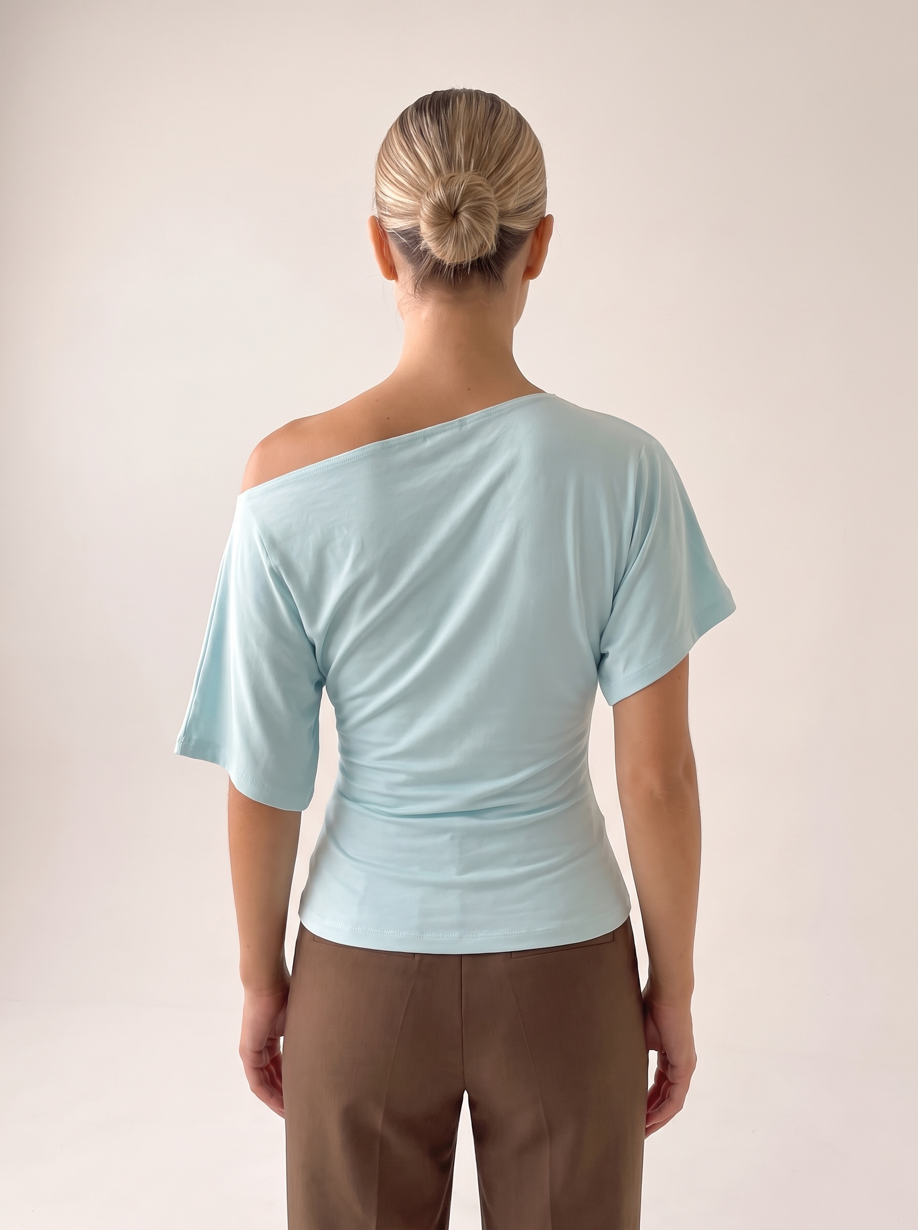 Asymmetric Neck Crop Top with Short Sleeves — full-length studio back view on a warm ivory seamless background