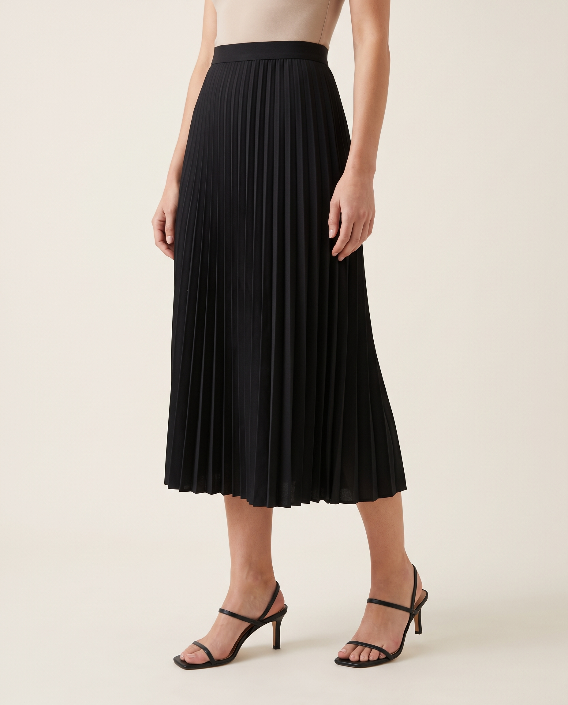 Black Pleated Midi Skirt — three-quarter view