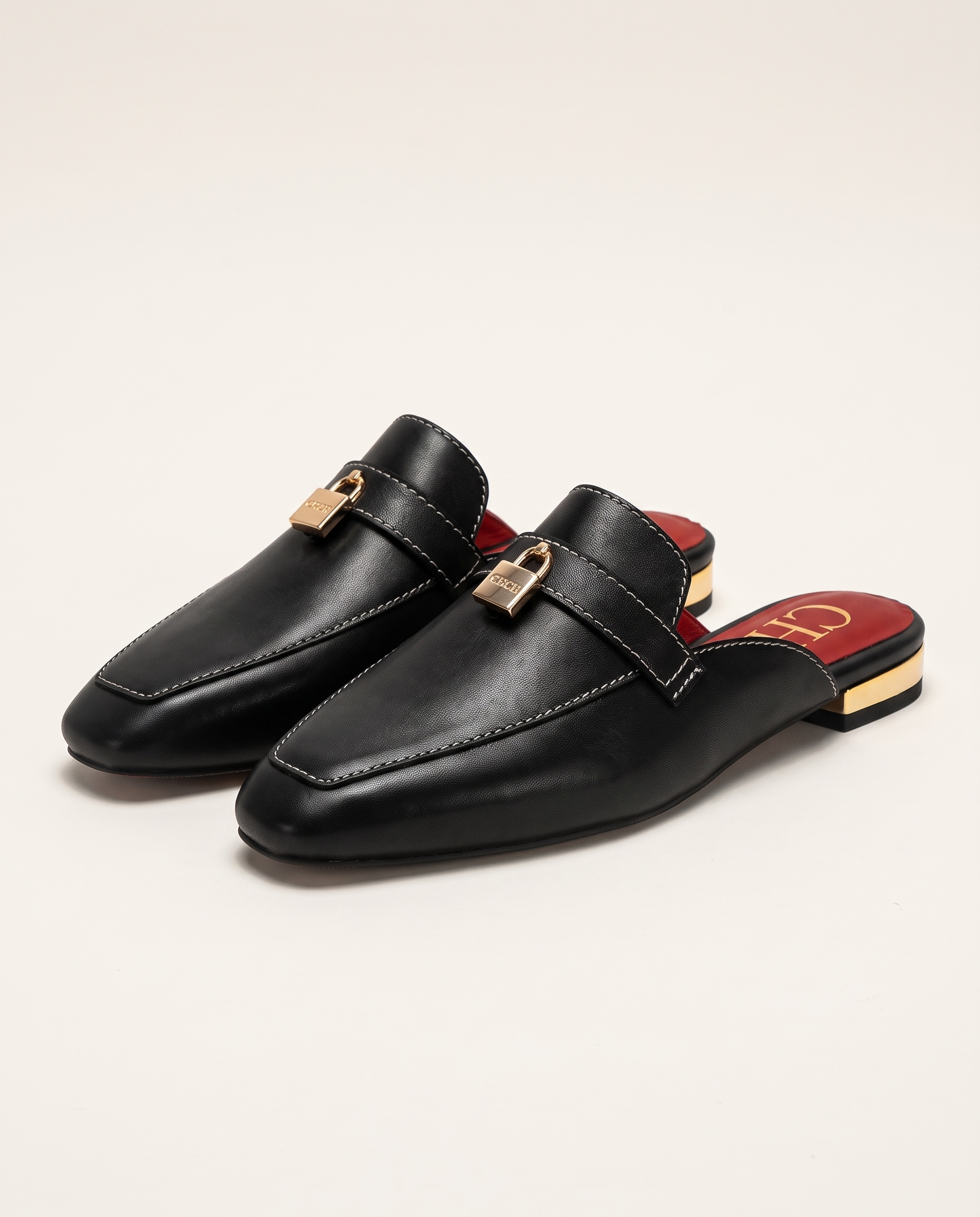 Calypso Classic Round-Toe Flat Mules — hero view