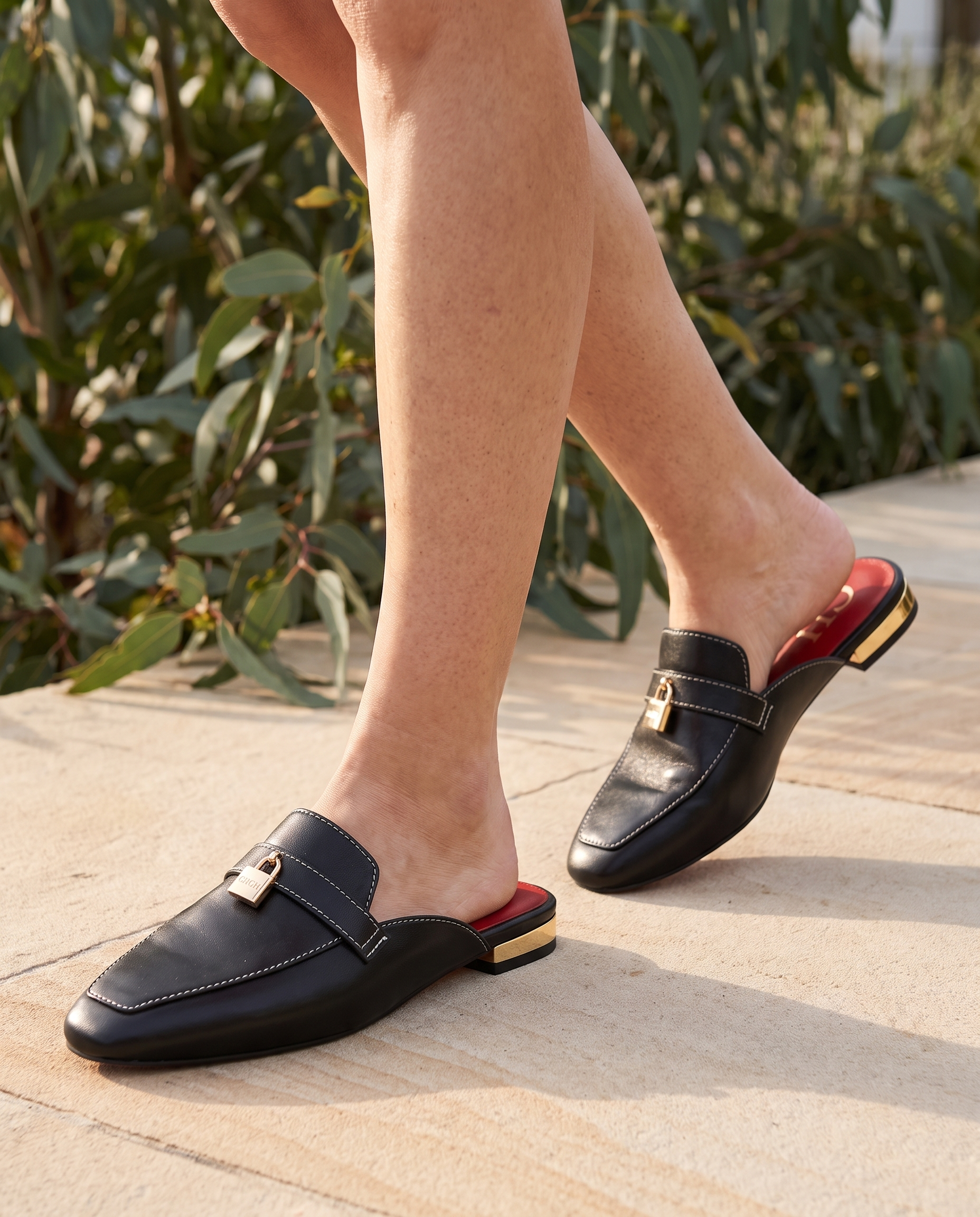 Calypso Classic Round-Toe Flat Mules — lifestyle view