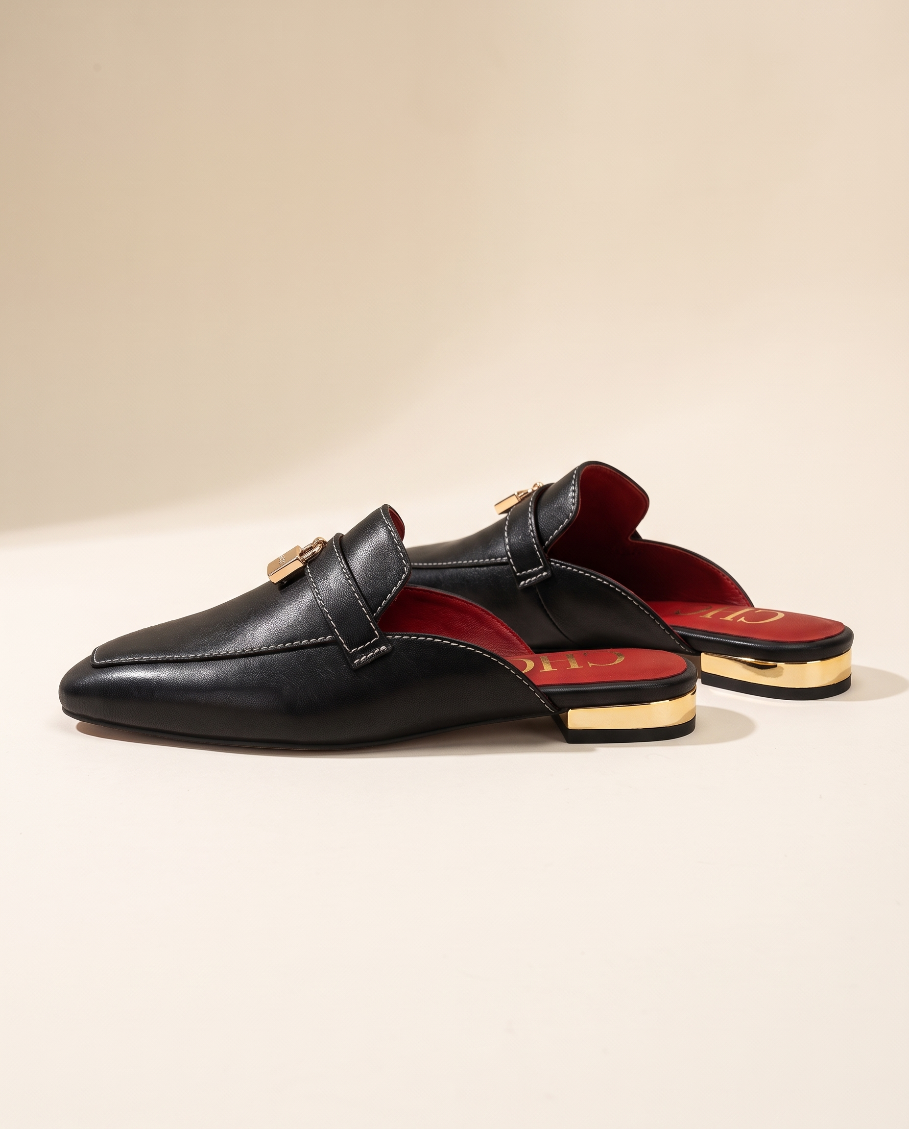 Calypso Classic Round-Toe Flat Mules — side view