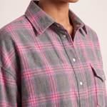 Checked Oversized Shirt with Button Front and Chest Pocket — tight editorial product detail showing the fabric texture, stitching, neckline and construction