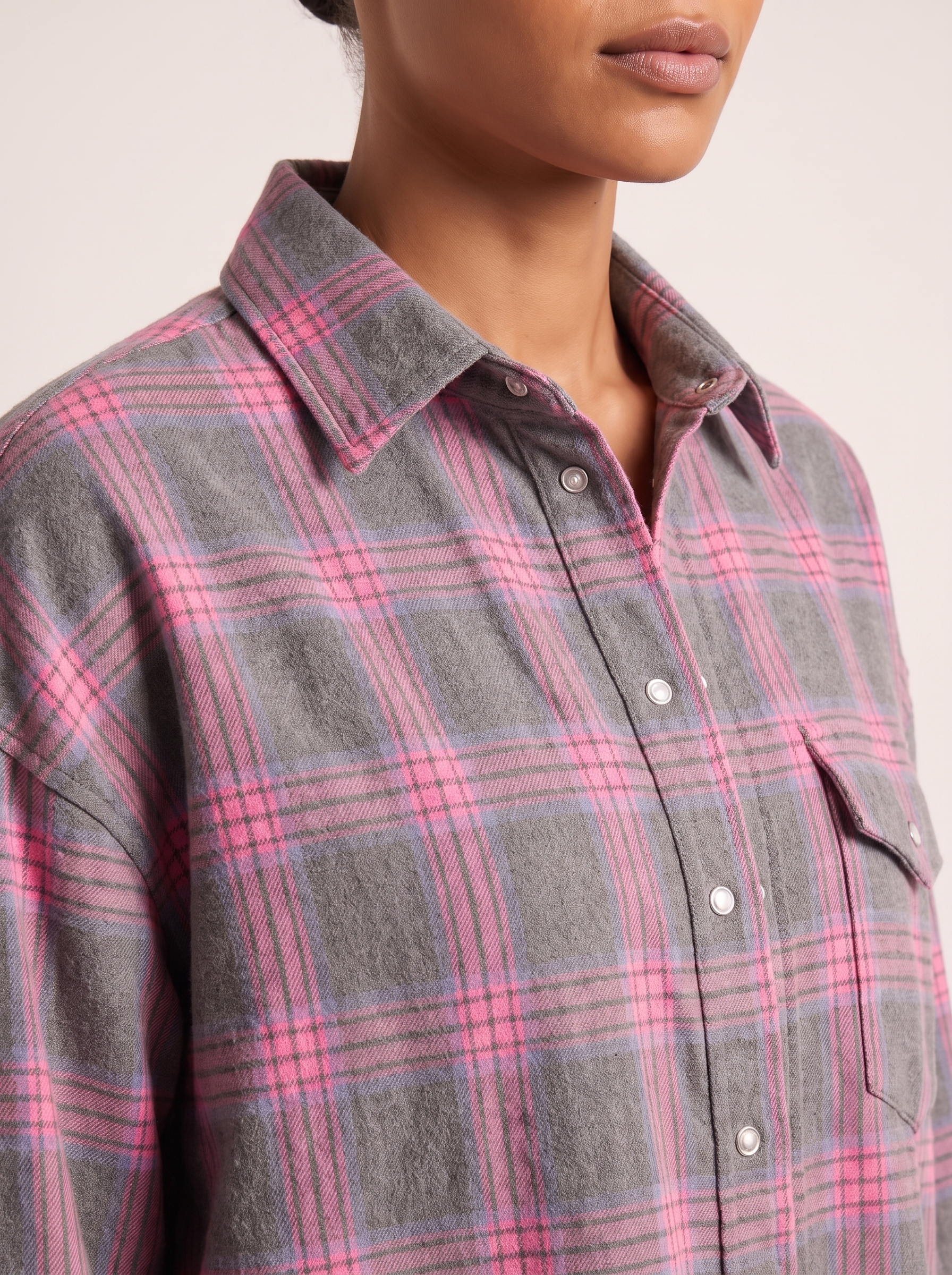 Checked Oversized Shirt with Button Front and Chest Pocket — tight editorial product detail showing the fabric texture, stitching, neckline and construction