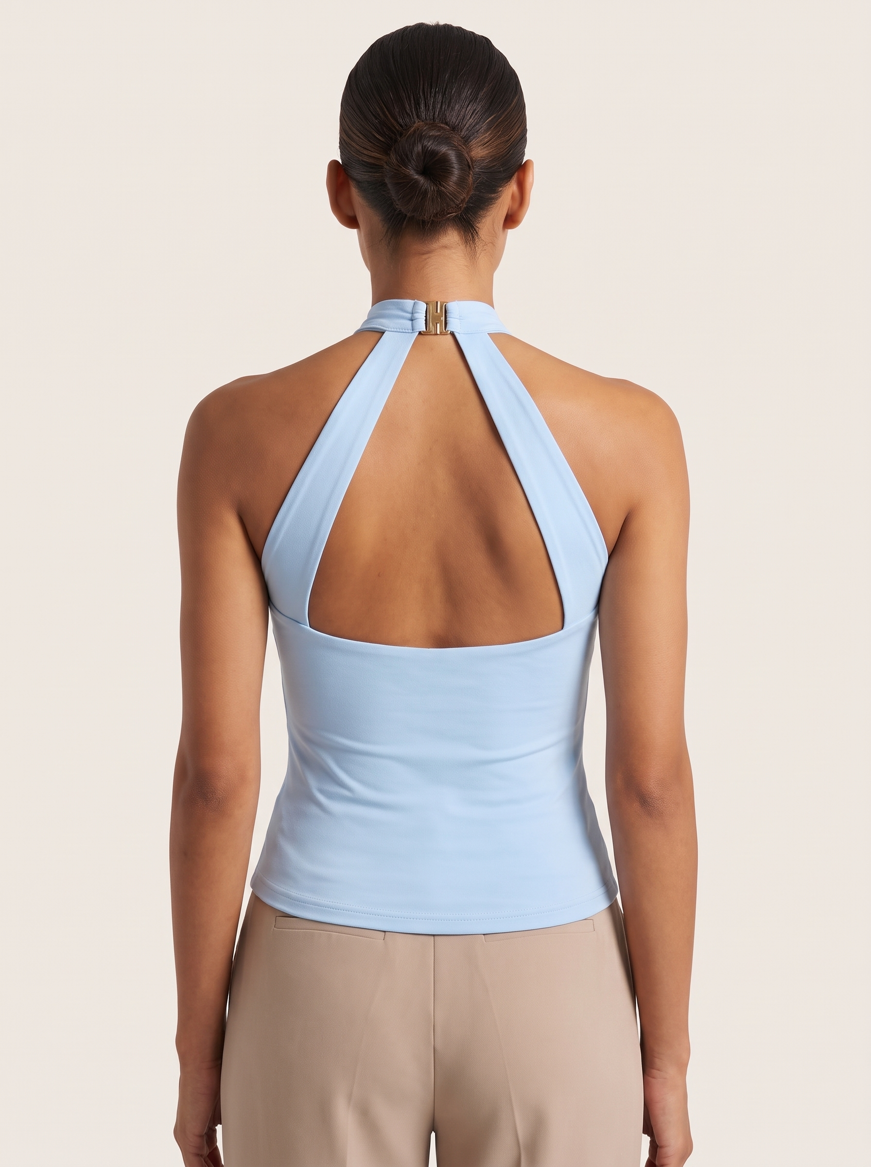 Halter Crop Top with Buckle Detail and Open Back — full-length studio back view on a warm ivory seamless background
