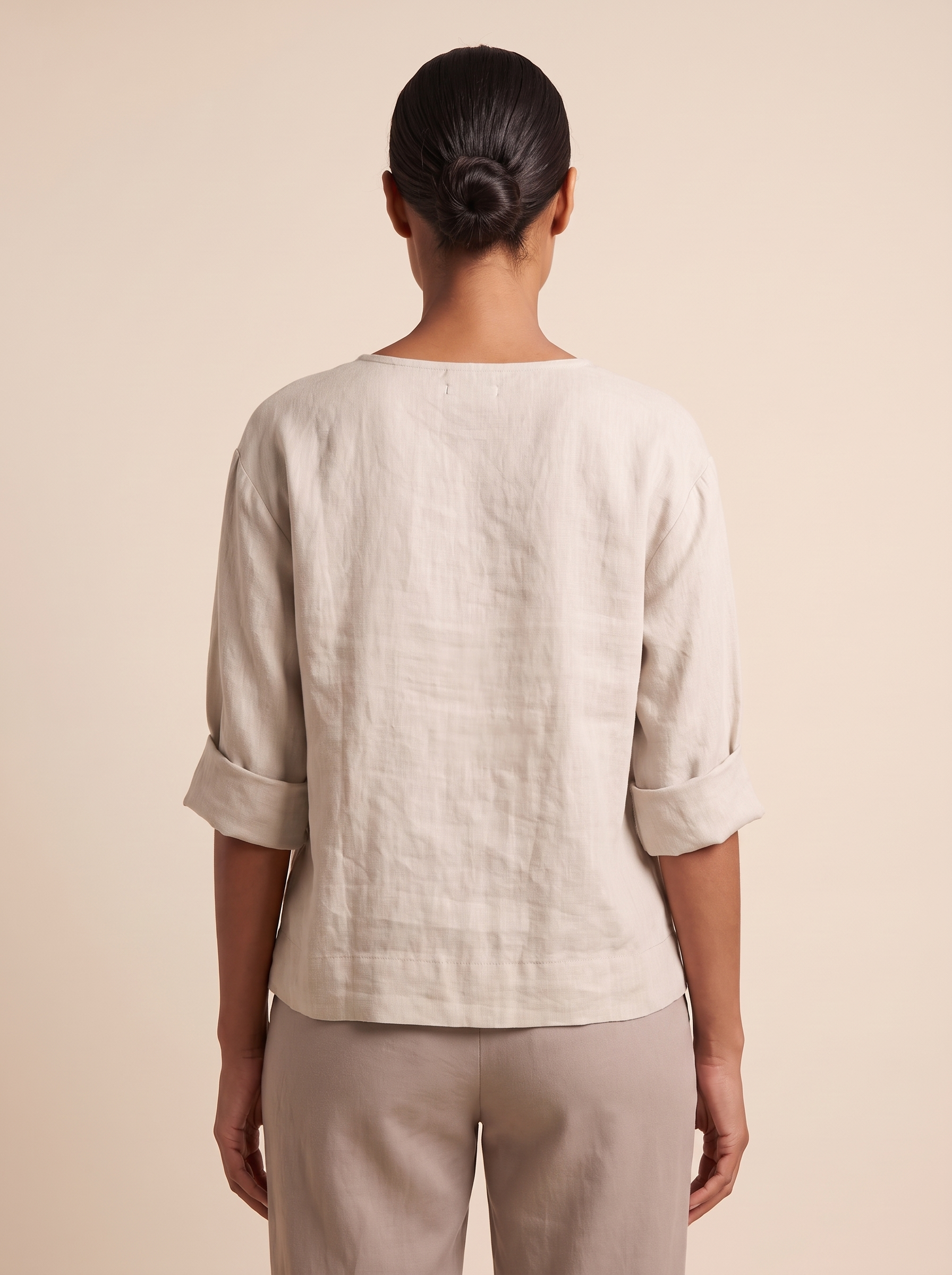Linen Blouse with V Neck and Three Quarter Sleeves — full-length studio back view on a warm ivory seamless background