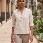 Linen Blouse with V Neck and Three Quarter Sleeves — natural full-body Australian lifestyle photograph on a refined Sydney streetscape in soft daylight