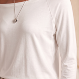 Off Shoulder Long Sleeve Top with Relaxed Fit — tight editorial product detail showing the fabric texture, stitching, neckline and construction