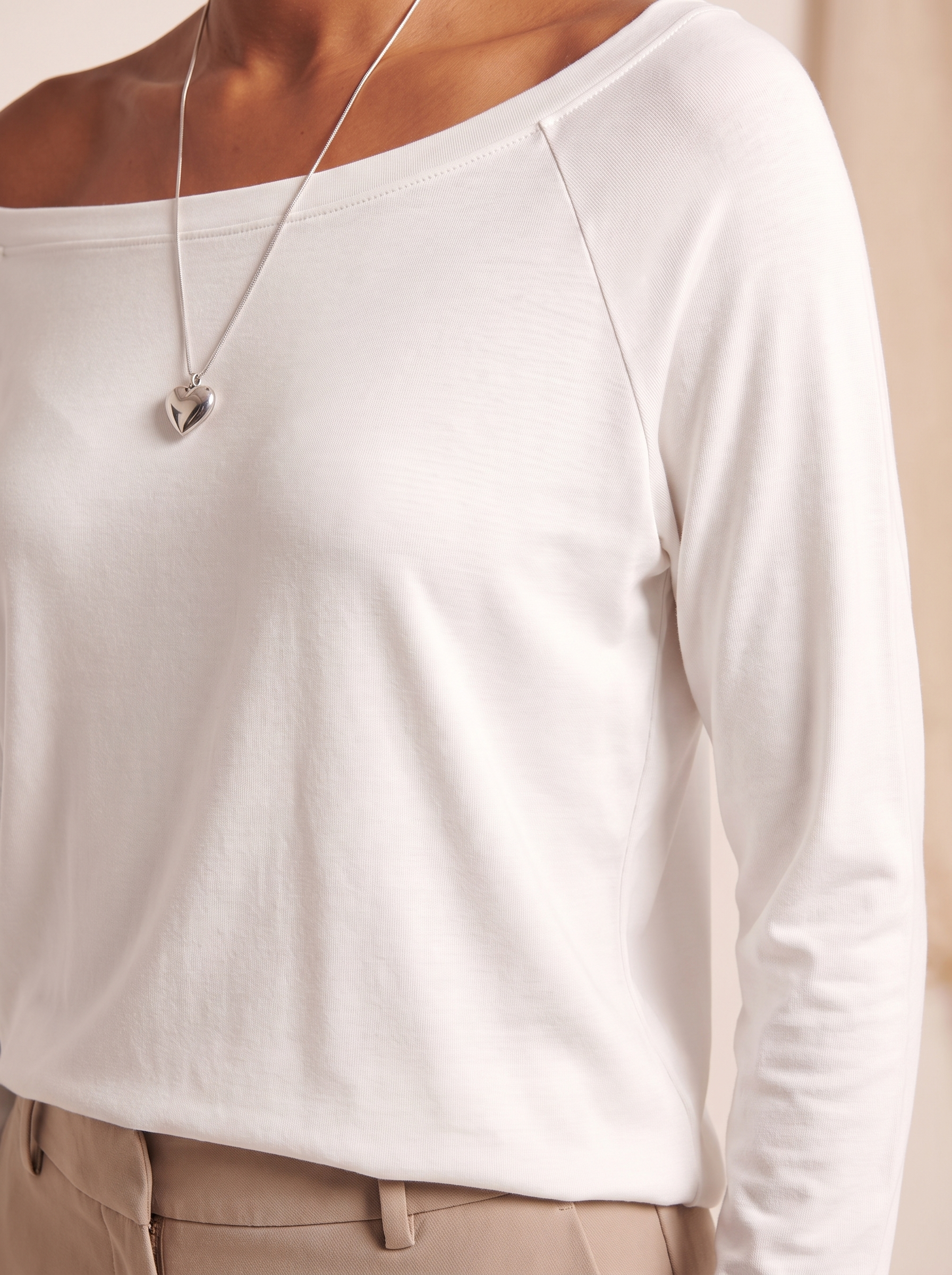 Off Shoulder Long Sleeve Top with Relaxed Fit — tight editorial product detail showing the fabric texture, stitching, neckline and construction
