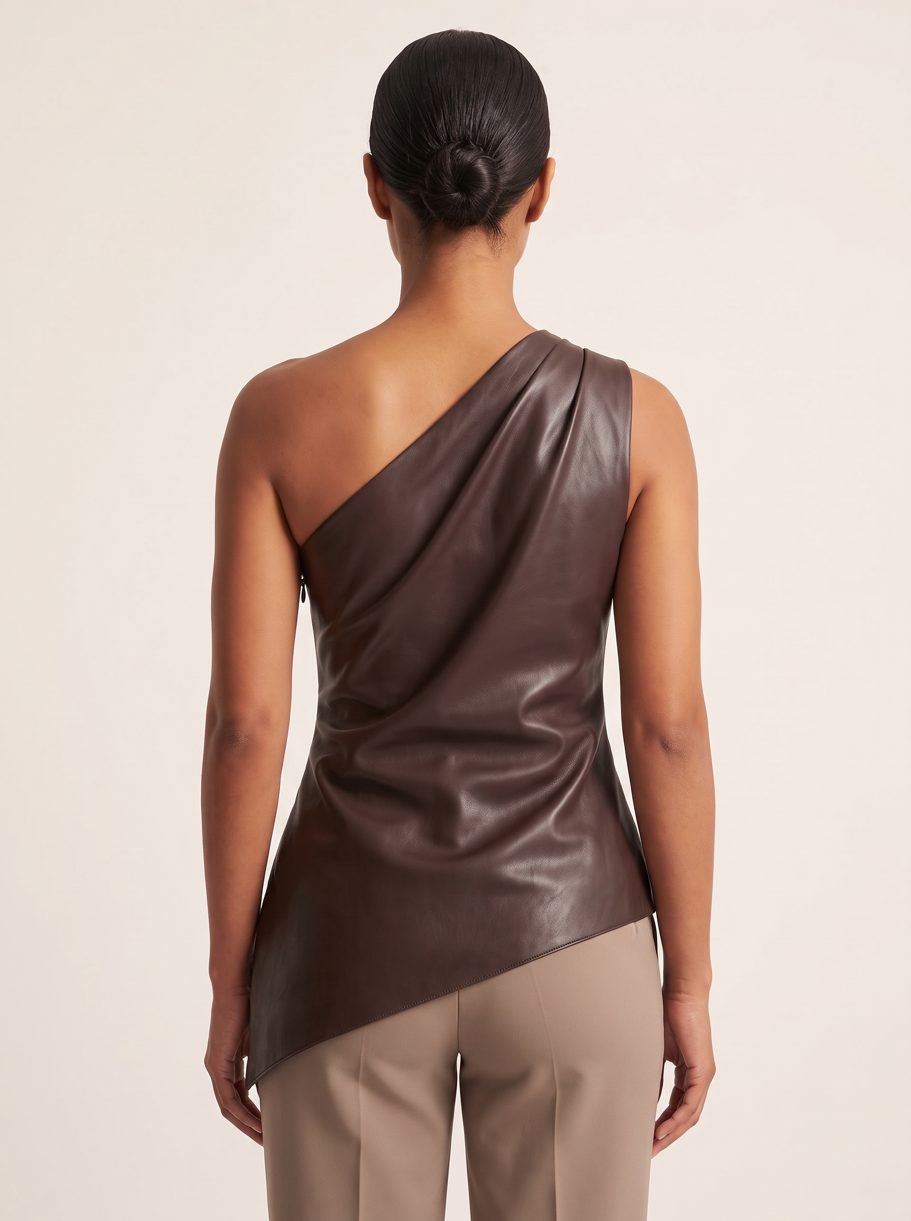 One Shoulder Top with Asymmetric Hem — full-length studio back view on a warm ivory seamless background