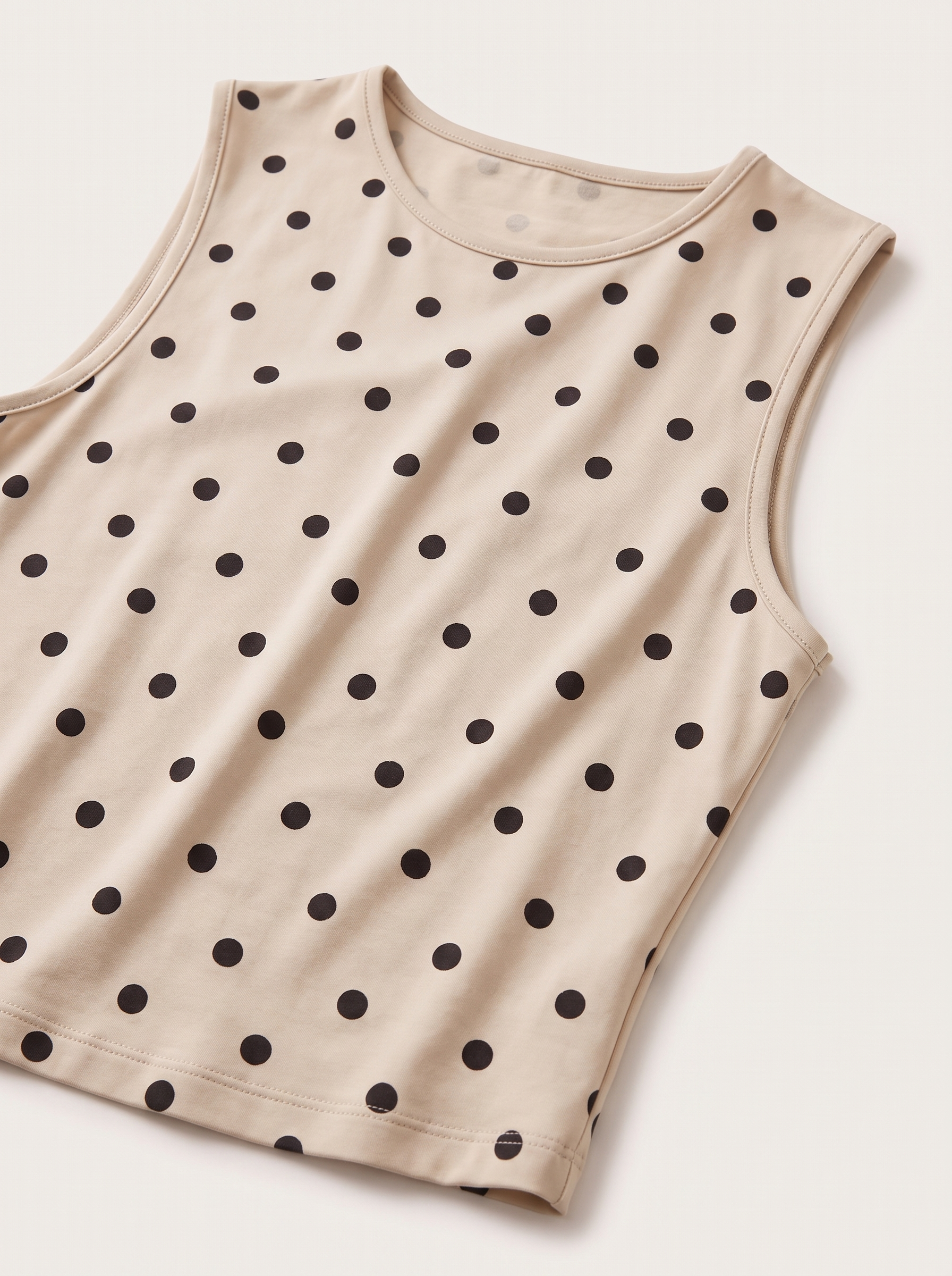 Polka Dot Crop Tank Top with Round Neck — tight editorial product detail showing the fabric texture, stitching, neckline and construction