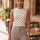 Polka Dot Crop Tank Top with Round Neck — natural full-body Australian lifestyle photograph at a tasteful Brisbane outdoor café in soft daylight