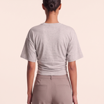 Relaxed Crop T Shirt with Crew Neck — full-length studio back view on a warm ivory seamless background