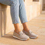 Beige loafer sneaker lifestyle on sandstone terrace