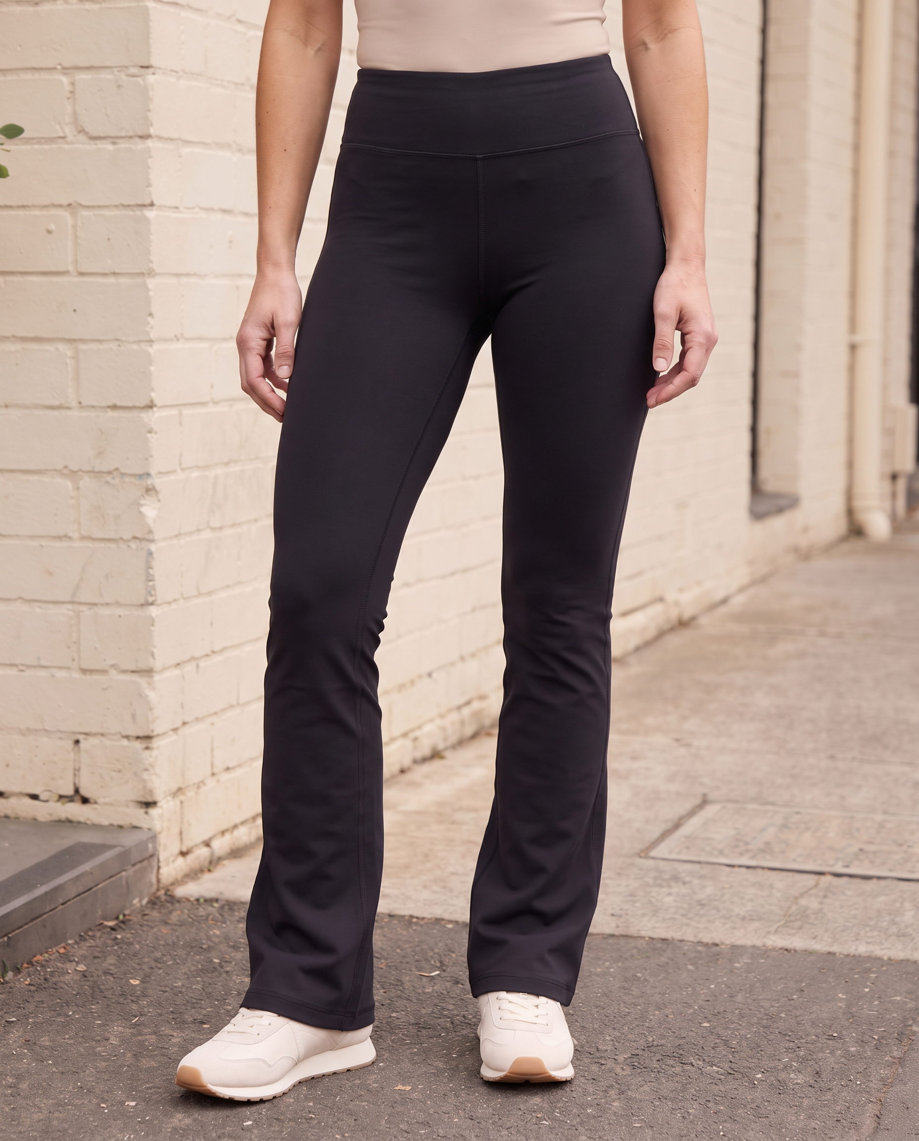 Flared Leggings in Black, close lifestyle view