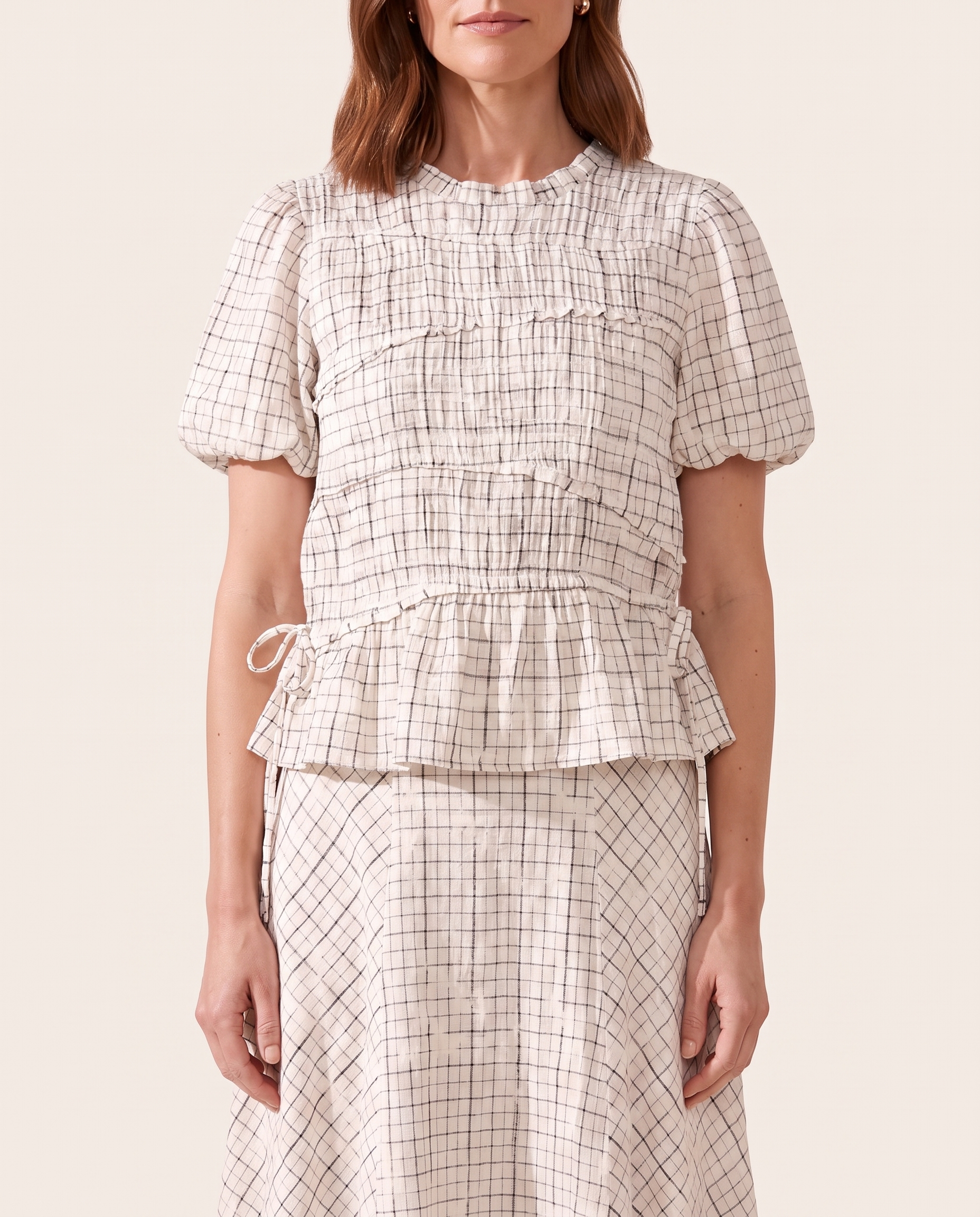 Checked top and skirt worn fabric detail