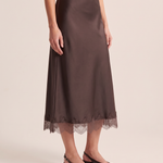 Three-quarter view of the Coffee lace trim midi skirt and its gently flared silhouette