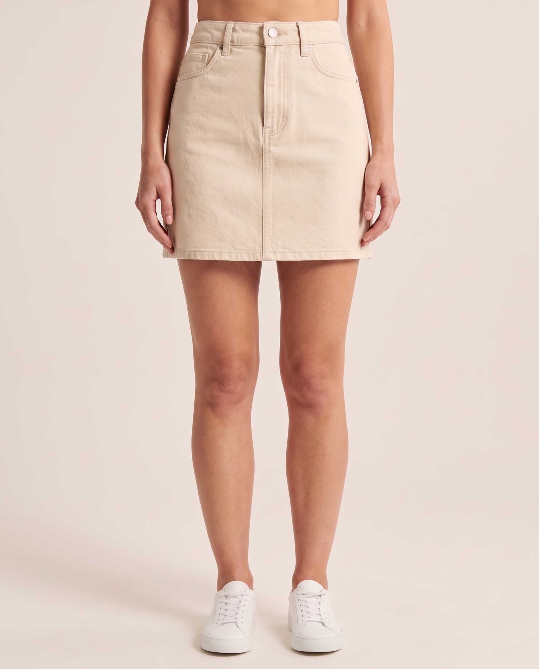 Denim Mini Skirt — Beige studio front view