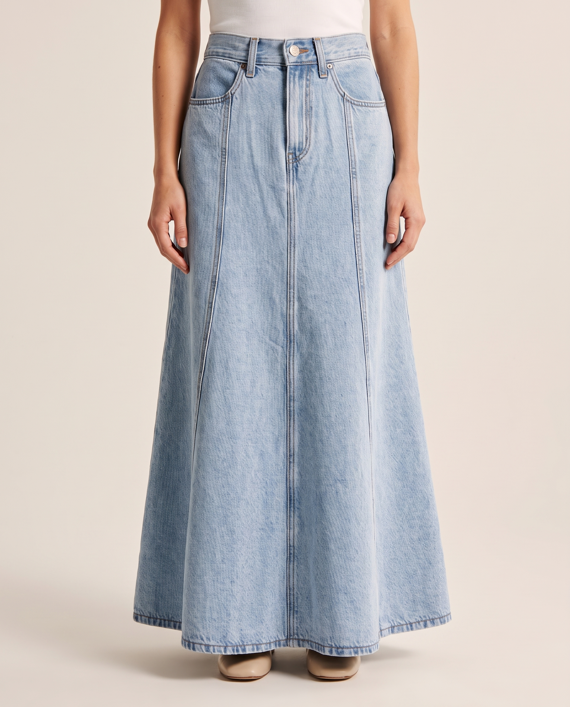 Light-Wash Pleated Denim Midi Skirt — three-quarter view