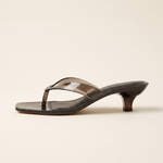 Black open-back thong sandal, low heel side profile