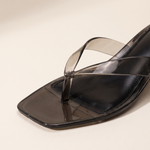 Close-up of the translucent black thong straps and square toe