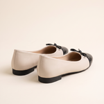 Cap-Toe Ballet Flats with Bow — back view