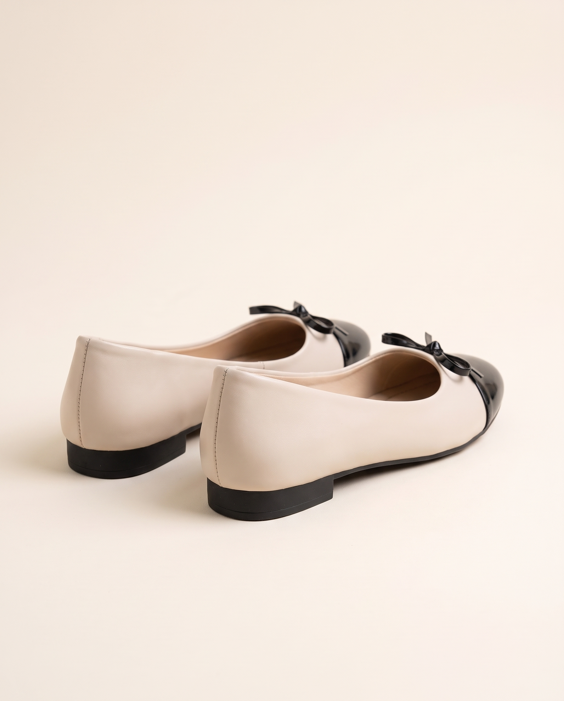 Cap-Toe Ballet Flats with Bow — back view