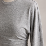 Slim Fit Long Sleeve Crop Top with Crew Neck — tight editorial product detail showing the fabric texture, stitching, neckline and construction