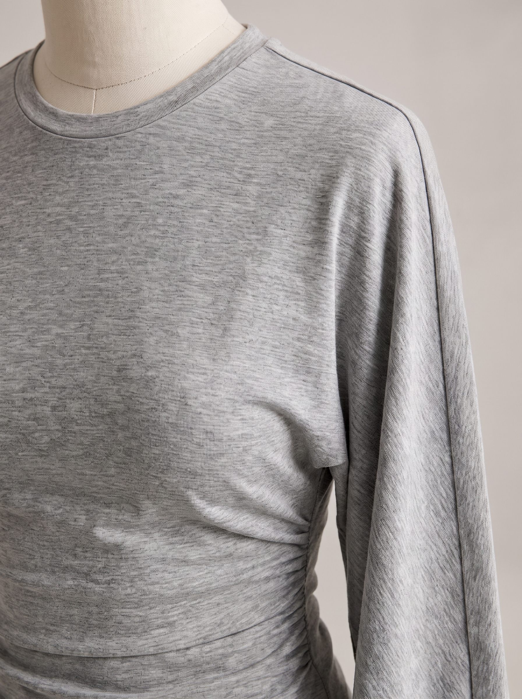Slim Fit Long Sleeve Crop Top with Crew Neck — tight editorial product detail showing the fabric texture, stitching, neckline and construction
