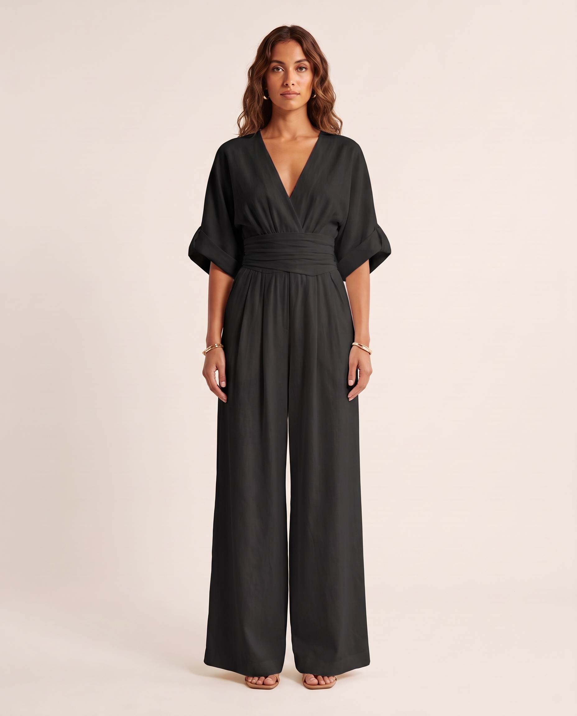 Surplice V-Neck Wide-Leg Jumpsuit — Black — studio front
