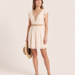 Women's Woven Mini Dress with V-Neck Trim and Flutter Sleeves — Apricot — studio three-quarter
